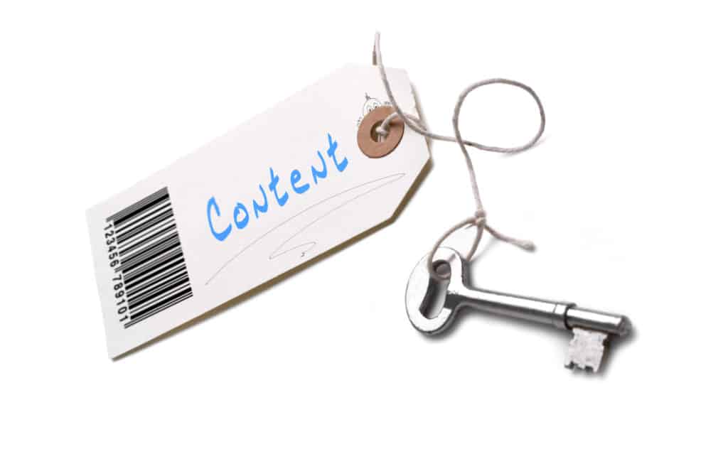 A silver key with a tag attached with a Content concept written on it.